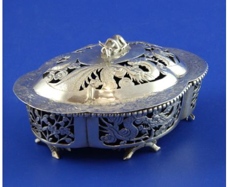 A late 19th/early 20th century Chinese pierced silver butter dish and cover, of quatrefoil shape, decorated with dragons and 