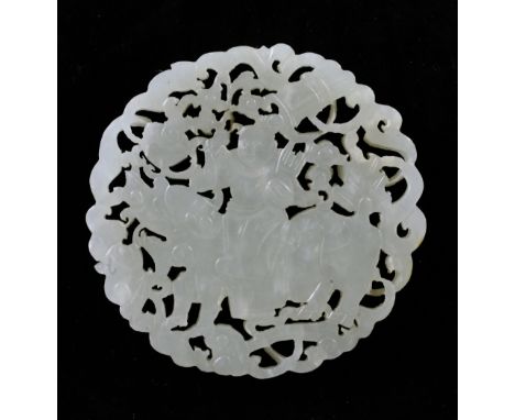 A Chinese pale celadon jade disc, late 19th / early 20th century, carved with the figure of an immortal riding a qilin, amid 