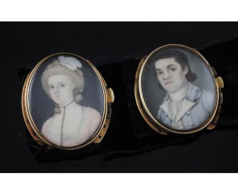 A pair of 19th century gold mounted mourning portrait miniature bracelet clasps, one of a lady and one of a gentleman, each w