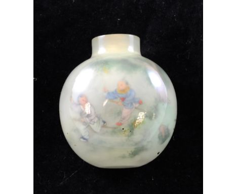 A Chinese inside-painted agate snuff bottle, 20th century, well painted with boys playing in a garden to each side, the stone