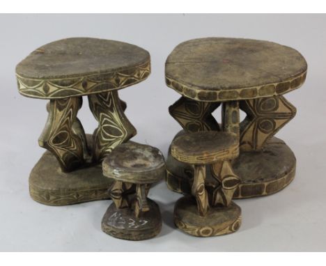 Papua New Guinea Sepik River, two tribal tables, each carved from a single section of tree trunk, with circular top and base,