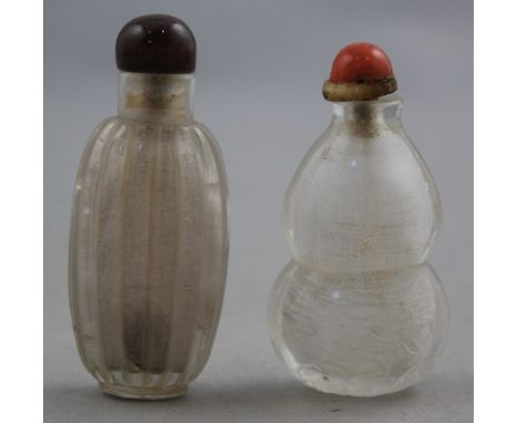 Two Chinese rock crystal snuff bottles, 1800-1900, the first of ribbed ovoid shape, 6cm, the second of double gourd form carv