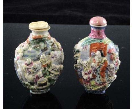 Two Chinese moulded famille rose snuff bottles, 1820-50, the first with boys playing in a pavilion garden, Qianlong mark, the