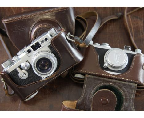 A 1950's Leica III G camera, with a Leitz Elmar 50mm 1:2.8 lens, together with a 1930's Leica standard camera with a Leitz El