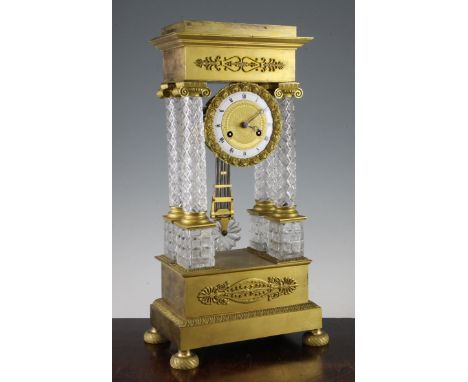 A 19th century French ormolu mounted cut glass portico clock, of traditional form with enamelled Roman chapter ring and unsig