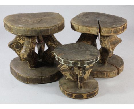 Papua New Guinea Sepik River, two tribal tables, each carved from a single section of tree trunk, with circular top and base,