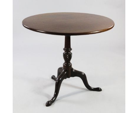 A George III mahogany circular tilt top tripod table, with twist turned central column, W.3ft