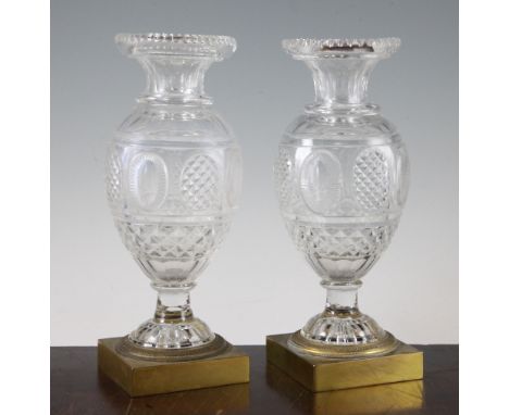 A pair of cut glass vases, first half 19th century, probably Baccarat, the facet cut ovoid bodies with oval cut panels, each 