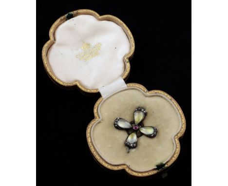 A late Victorian gold, moonstone, ruby and rose cut diamond brooch by Carlo & Arthur Giuliano, of quatrefoil form, set with f