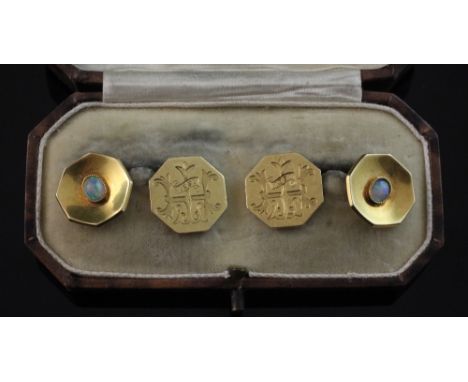 A pair of 1930's 18ct gold and white opal set octagonal cufflinks, with engraved monogram and date, gross 13 grams.