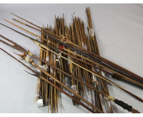 Papua New Guinea Sepik River, a collection of seven tribal spears, various, a tribal bow and a large collection of bamboo arr