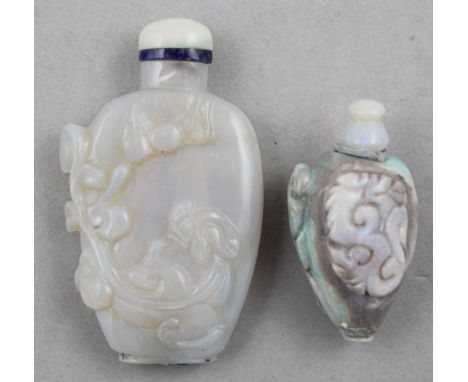 Two Chinese opal snuff bottles, 1880-1940, the first of flattened baluster form, carved in high relief with lingzhi fungus, 5