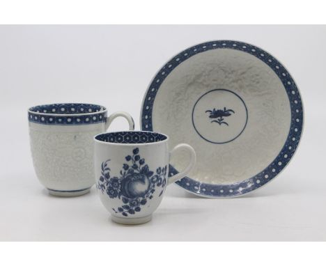 A Worcester coffee cup and saucer, circa 1770, relief moulded with flowers and foliage, painted in blue with a cell border, s