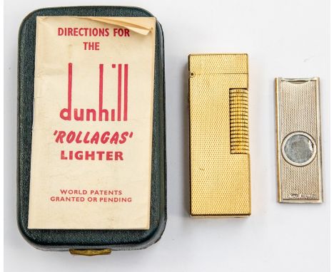 A gold plated Dunhill lighter, rectangular form with engine turned decoration, size approx 6.3cm x 2.2cm x 1cm, with original