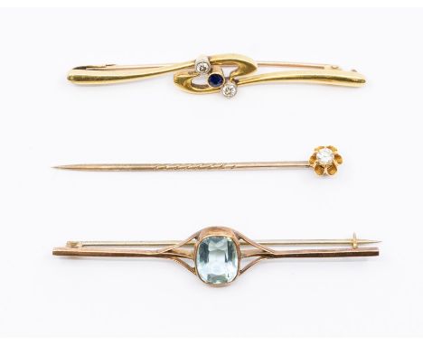 A yellow metal sapphire and diamond bar brooch, stamped 15ct, approx 6cm long, approx 5.1gms; a diamond-set stick pin, approx