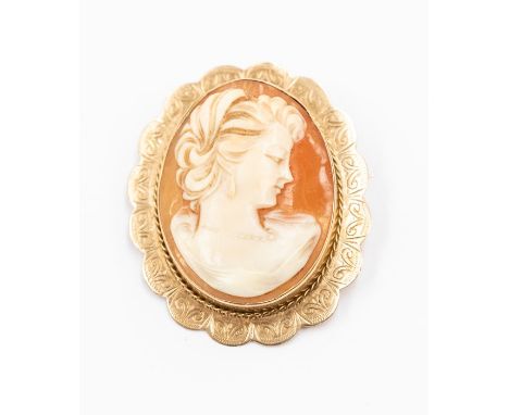 A 9ct gold mounted cameo brooch, depicting bust portrait of a lady, fancy engraved mount, size 30 x 37mm, total gross weight 