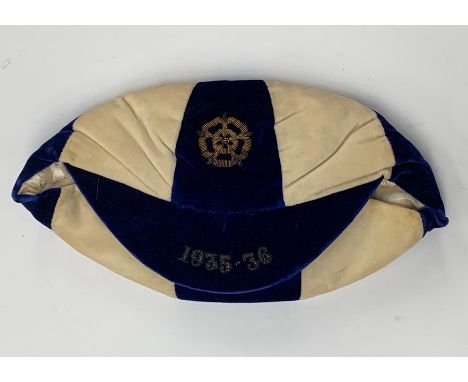 A blue and white England football cap, 1935-36, earned by George Male, pertaining to the game played v. The Netherlands, 18th