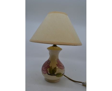 A Moorcroft Pottery baluster shaped table lamp, possibly in the Clematis pattern on a cream ground, with cream shade, 32cm hi