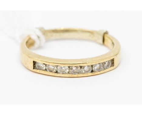 A 9ct gold diamond set dress ring, set with seven faceted stones, ring size Q, 2.83 grams approx