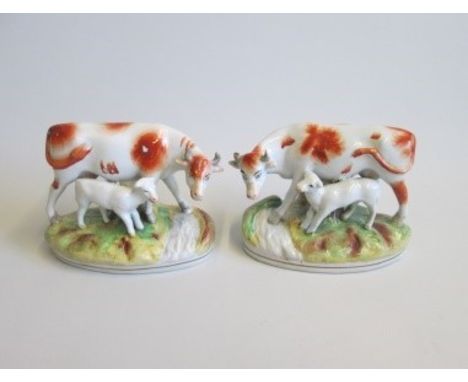 Pair of Staffordshire Cow and Calf groupsDate circa 1860Size  14cm diam  12cm highCondition   R Facing paint flakes to body o