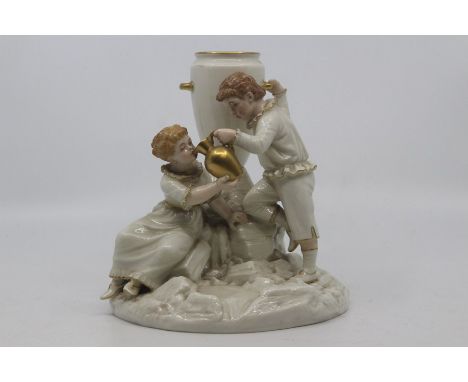 A Royal Worcester glazed parian figural spill vase designed by James Hadley, dated 1882, modelled as a boy and girl drinking 