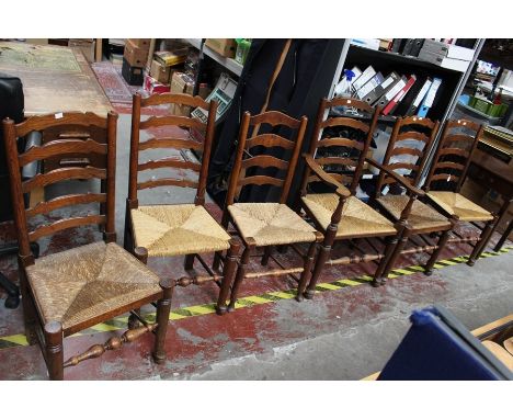 ***OBJECT LOCATION BISHTON HALL***&nbsp; An early 20th Century set of six oak ladder back chairs, with rush seats, comprising