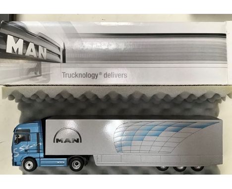 MAN Trucknology TGA 18.530 articulated truck by Conrad, model ZY CO661-5800, boxed, along with unboxed MAN TGX 18.680 with ta