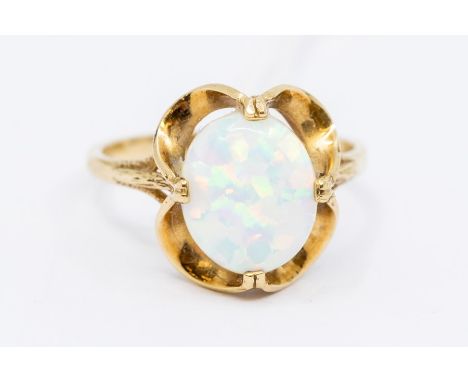 A 9ct gold opal ladies dress ring, the opal claw set and open backed, ring size S, 3.24 grams approx