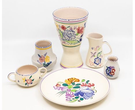A collection of Poole Pottery including jugs, vases, plates etc