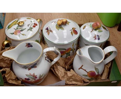 A Royal Worcester Evesham part dinner service comprising jug, biscuit barrel, teapot, condiments, tray, sugar bowl, milk jugs