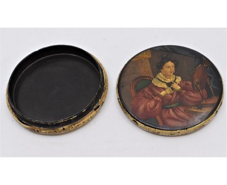 A late 18th Century, early 19th Century pill/snuff box, lacquered paper mache with hand painted naive lady looking in mirror
