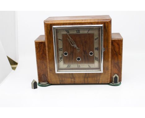 An Art Deco oak eight day mantle clock with Westminster chime, applied with a silver mount dated 1940 and an Art Deco walnut 