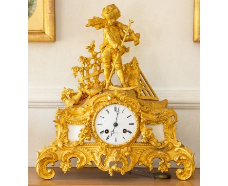 A French ormolu rococo revival mantel clock by Henri Marc, late 19th Century, surmounted by a boy gathering wheat with a scyt