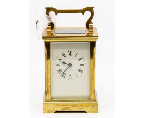 A 19th Century brass carriage clock, possibly French, white dial, four pillared movement, 13 cms high approx