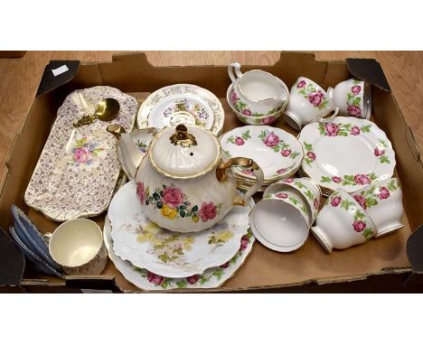 A Royal Albert Crown china part tea set, in the Imari pattern; cups, saucers, side plates, cream jug, sugar bowl, cake plates