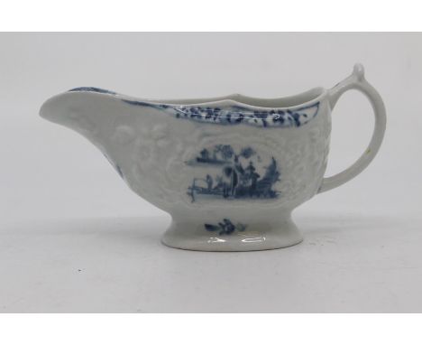 A Worcester sauce boat, circa 1760-65, of moulded oval form and painted in blue with a Chinese river scene, possibly 'Fisherm