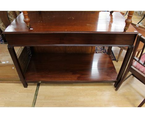 A 20th Century mahogany two-tier serving table, 84cm high, 130cm wide, 60cm deep, a pine trunk with brass gallery top and a m