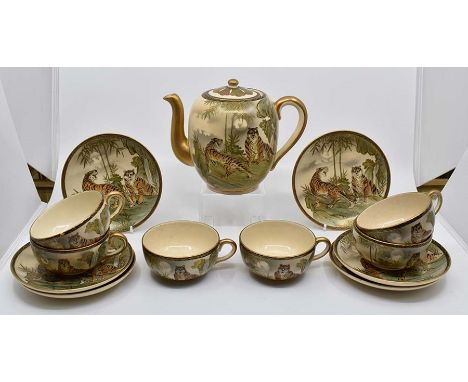 A Japanese hand painted part tea set, probably Meiji period, to include a teapot, two handled lidded sugar bowl, six cups, si