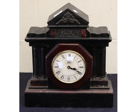 A large French black slate 19th Century mantel clock with black and gilt face classical figures either side, along with anoth