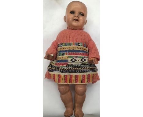 A 20th century bisque head doll, marked to neck '133 3/0', sleep eyes, open mouth, revealing two top teeth, composition body,