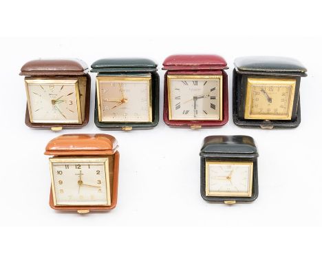 Six small leather cased travel clocks, the Swiss eight day movements in square cases, varying colours, 6-7cm (dials approx. 5