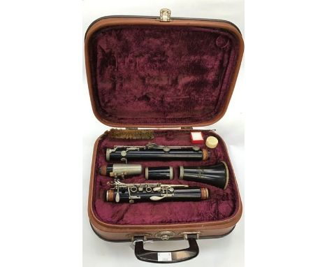 A 1970's cased clarinet, by Corton, complete with accessories