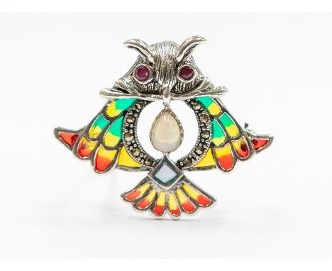 A plique a jour silver brooch/pendant in the form of an owl set with an opal and faceted garnets and mother of pearl, length 