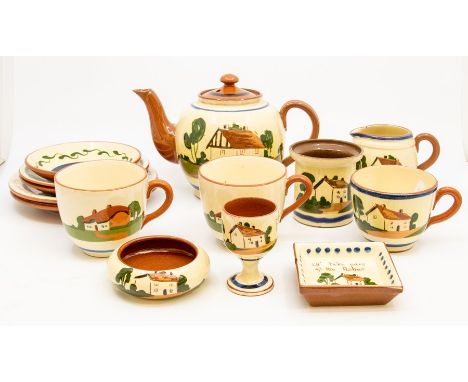 A Torquay ware terracotta part tea set comprising teapot, 3 cups and saucers, side plates, egg cut, trinket dishes, jug etc