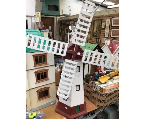 A handmade garden windmill and a similar weather vane, mid-20th century, windmill height at highest point approx. 119cm. (2)