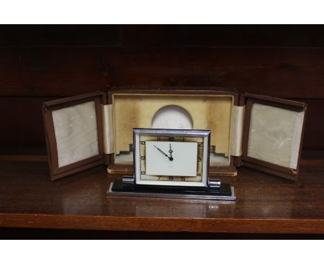 An Art Deco travel clock by Smiths in original fitted leather case&nbsp;