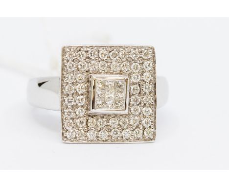 A diamond and 18ct white gold dress ring, squared central setting set with nine princess cut diamonds within a border of pave