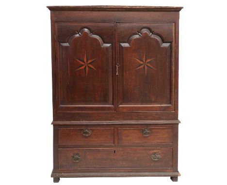 An Early 18th Century Joined Oak Cupboard, the later cornice above a plain frieze and two arched cupboard doors inlaid with s