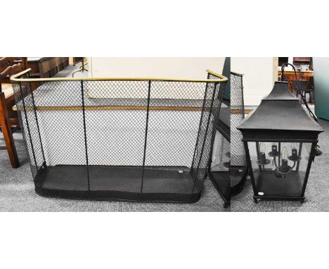A Spark Guard, 91cm by 28cm by 61cm and A Four Glass Lantern, 61cm high (2)