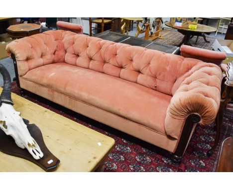 A Victorian Chesterfield Sofa, with buttoned pink upholstery, 220cm by 85cm by 67cm